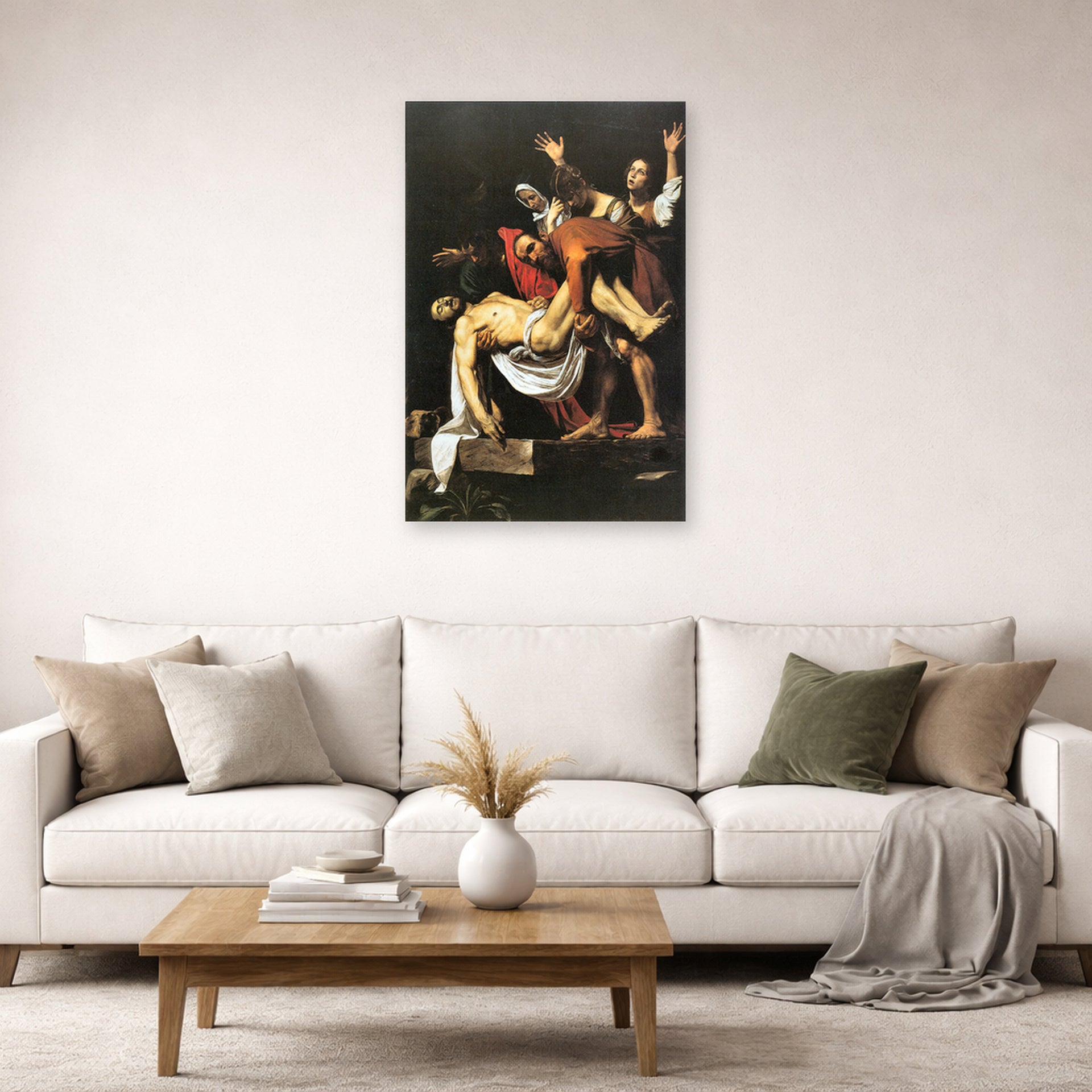 Unframed poster print of Caravaggio's 'The Entombment of Christ' displayed on a wall in a living room