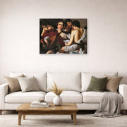 Gallery-wrapped canvas print of Caravaggio's 'The Musicians' displayed on a wall in a living room