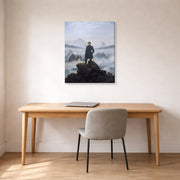 Gallery-wrapped canvas print of Caspar David Friedrich's The Wanderer above the Sea of Fog displayed on a wall in a office