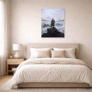 Unframed poster print of Caspar David Friedrich's The Wanderer above the Sea of Fog displayed on a wall in a bedroom
