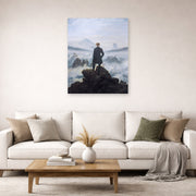 Unframed poster print of Caspar David Friedrich's The Wanderer above the Sea of Fog displayed on a wall in a living room