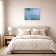 Gallery-wrapped canvas print of Claude Monet's 'Charing Cross Bridge' displayed on a wall in a bedroom