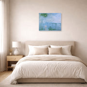 Unframed poster print of Claude Monet's 'Charing Cross Bridge' displayed on a wall in a bedroom