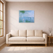 Unframed poster print of Claude Monet's 'Charing Cross Bridge' displayed on a wall in a living room