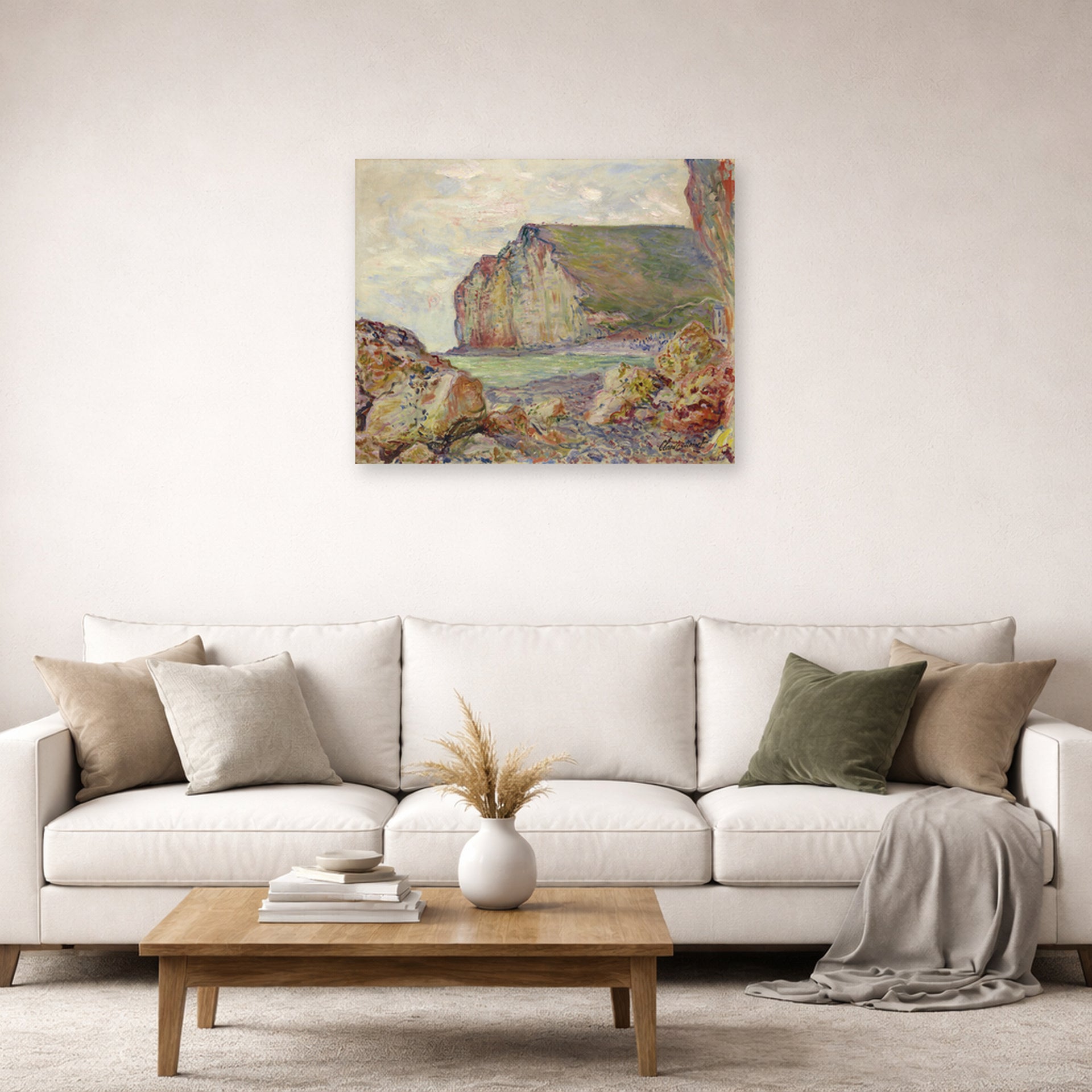 Unframed poster print of Claude Monet's 'Falaises Des Petites Dalles' displayed on a wall in a living room