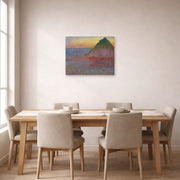 Unframed poster print of Claude Monet's 'Meule' displayed on a wall in a dining room
