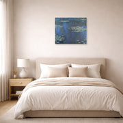 Unframed poster print of Claude Monet's 'Nympheas' displayed on a wall in a bedroom