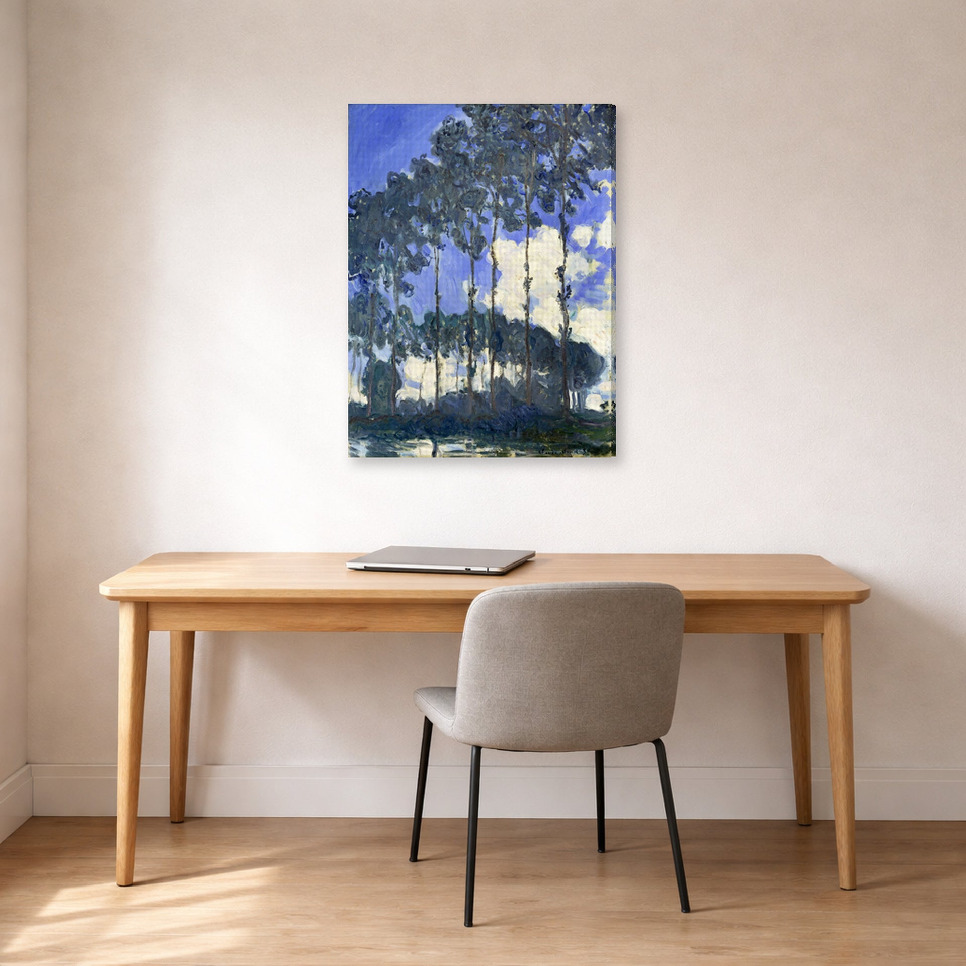 Gallery-wrapped canvas print of Claude Monet's 'Poplars on the Epte' displayed on a wall in a office
