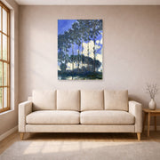 Unframed poster print of Claude Monet's 'Poplars on the Epte' displayed on a wall in a living room