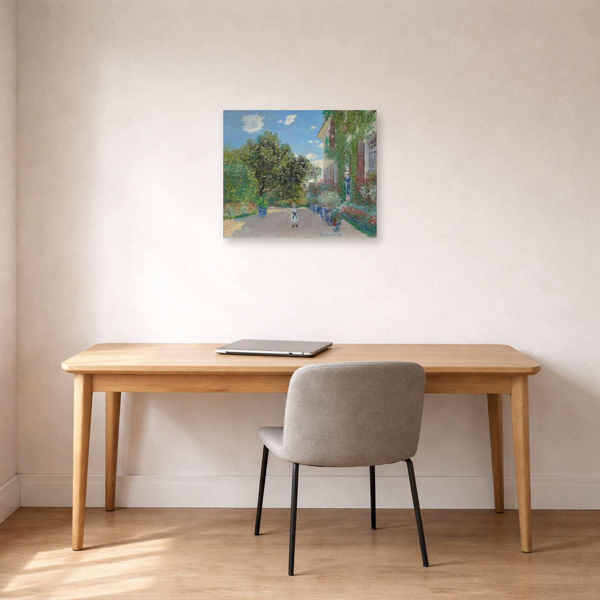 Unframed poster print of Claude Monet's 'The Artist's House at Argenteuil' displayed on a wall in a office