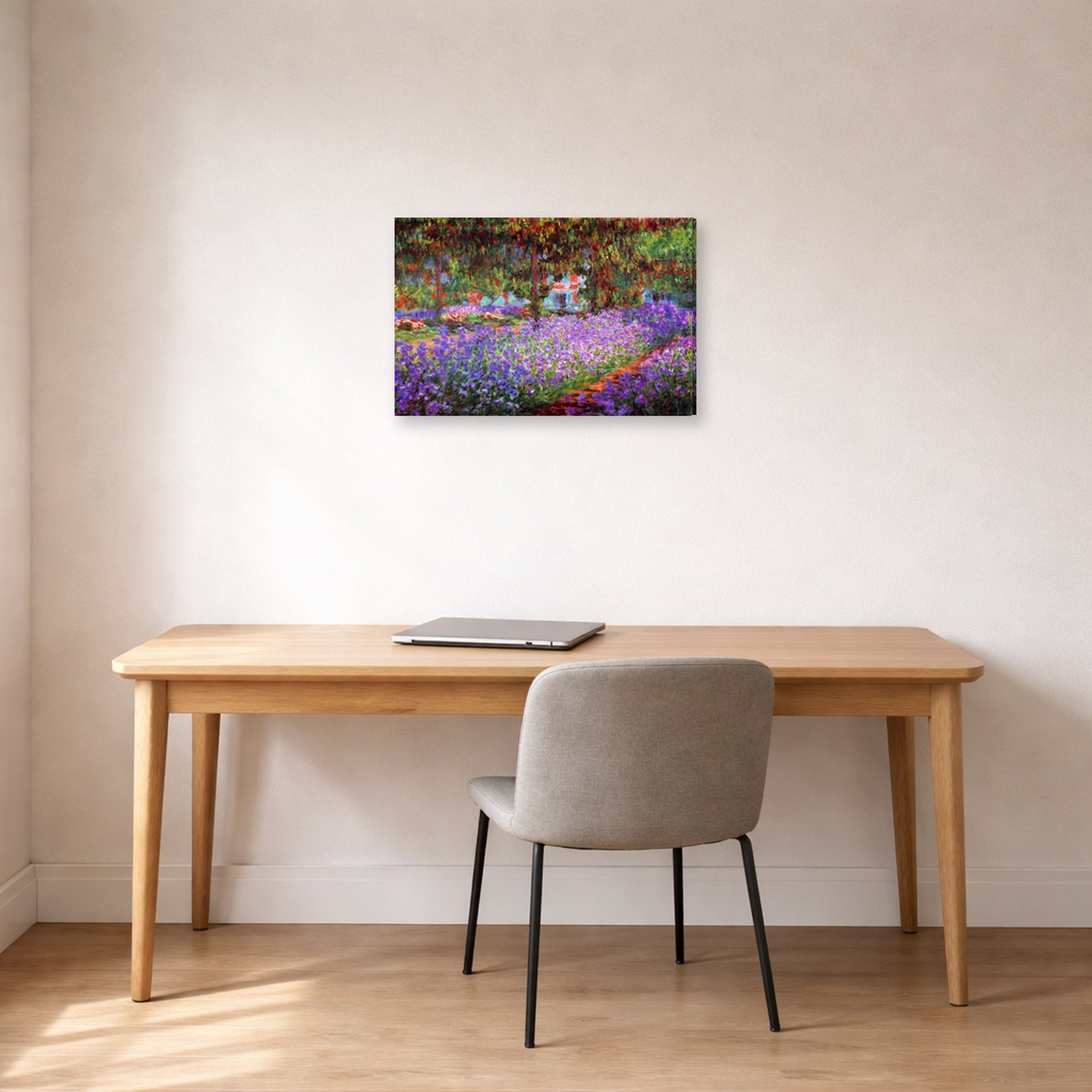 Gallery-wrapped canvas print of Claude Monet's 'The Artists Garden at Giverny' displayed on a wall in a office