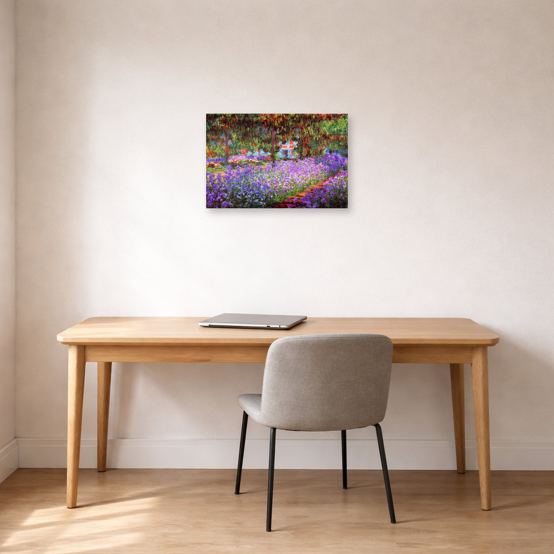 Unframed poster print of Claude Monet's 'The Artists Garden at Giverny' displayed on a wall in a office