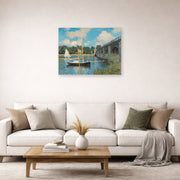 Unframed poster print of Claude Monet's 'The Bridge at Argenteuil' displayed on a wall in a living room