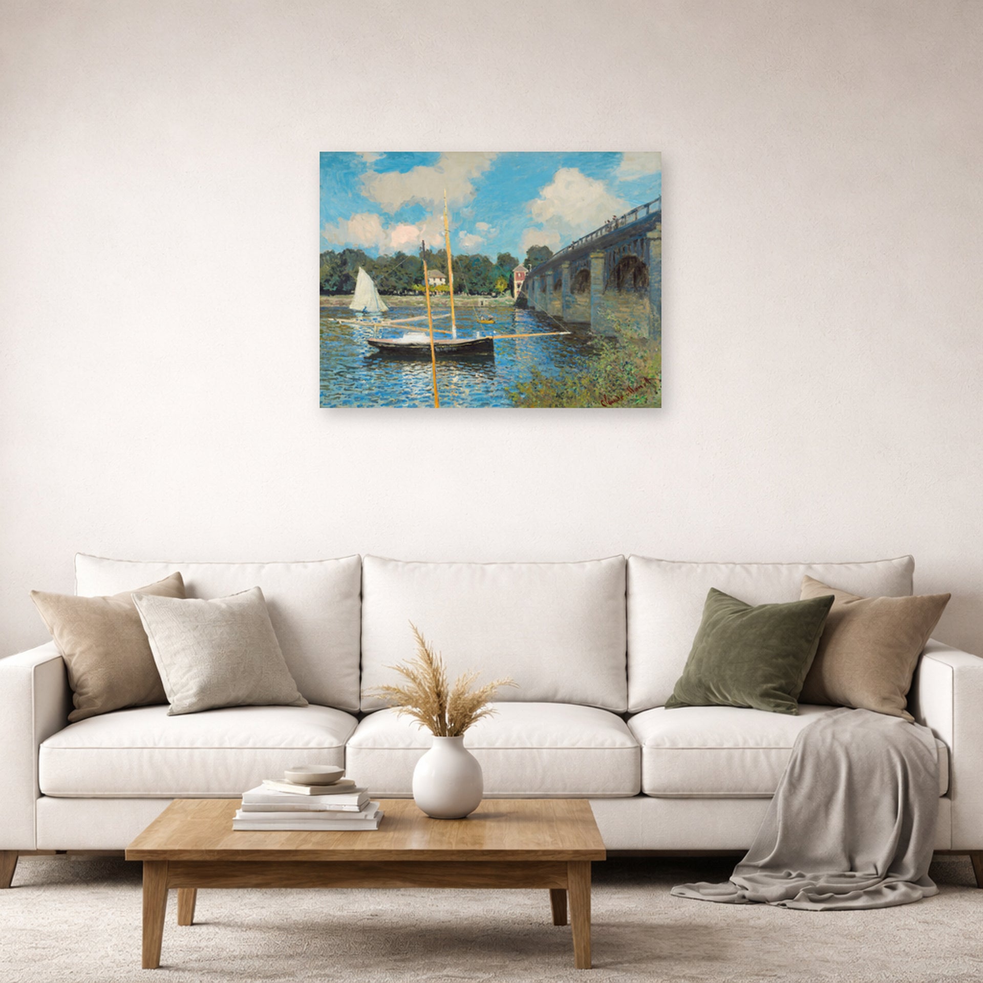 Unframed poster print of Claude Monet's 'The Bridge at Argenteuil' displayed on a wall in a living room