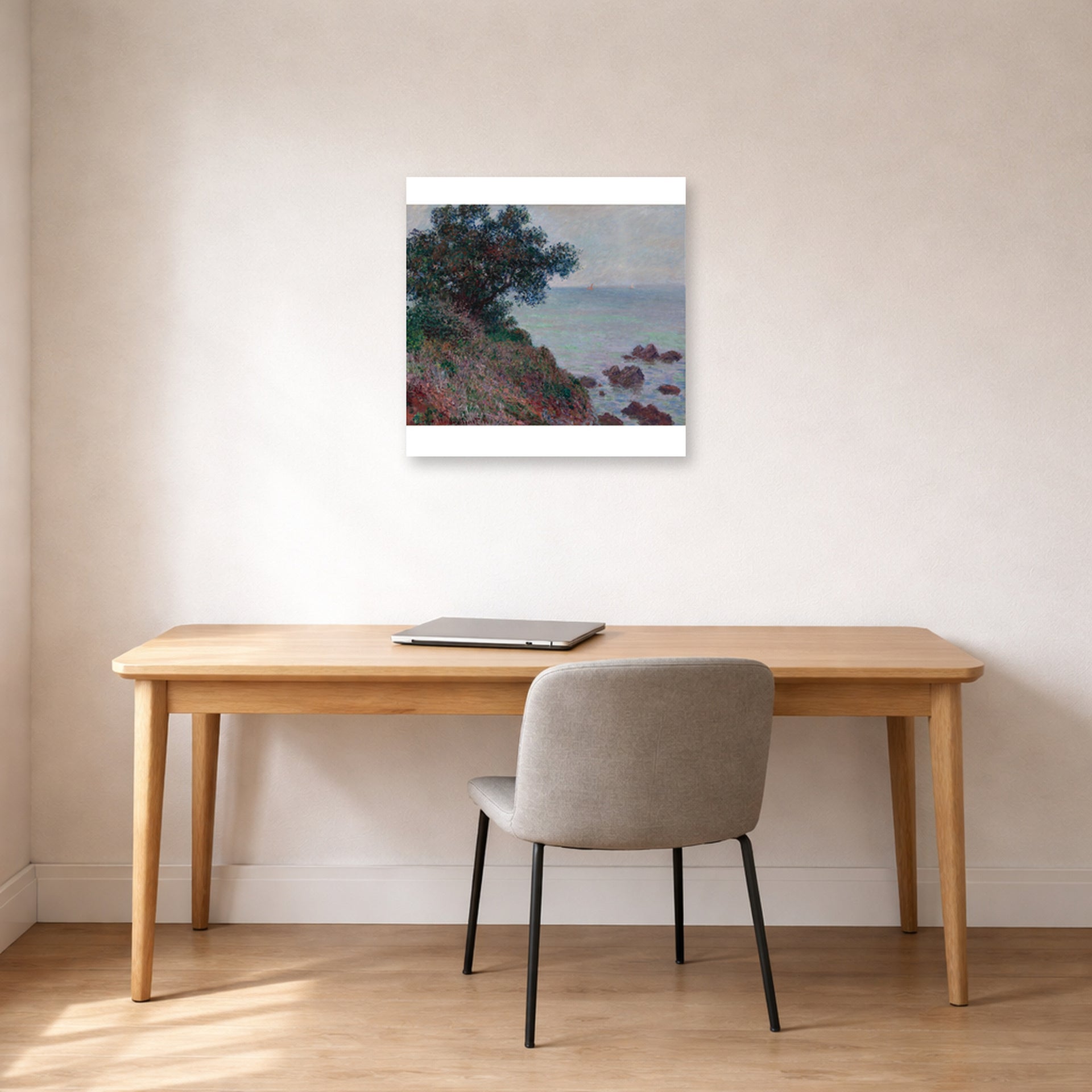 Unframed poster print of Claude Monet's 'The Edges of the Mediterranean, Gray Time' displayed on a wall in a office