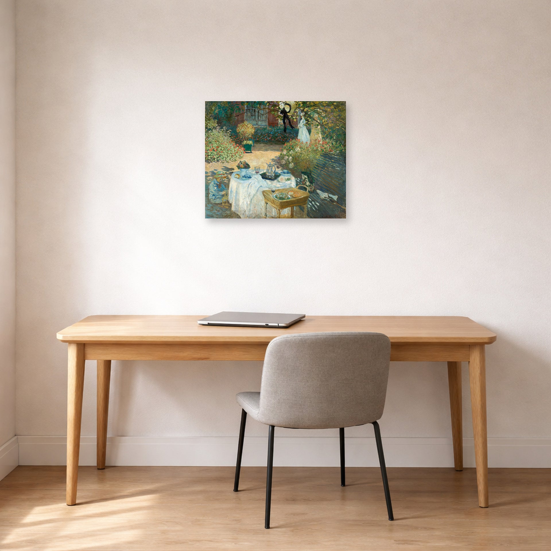 Unframed poster print of Claude Monet's 'The Luncheon, Monet's Garden at Argenteuil' displayed on a wall in a office
