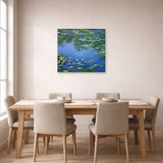 Gallery-wrapped canvas print of Claude Monet's 'Water Lilies' displayed on a wall in a dining room
