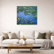 Gallery-wrapped canvas print of Claude Monet's 'Water Lilies' displayed on a wall in a living room