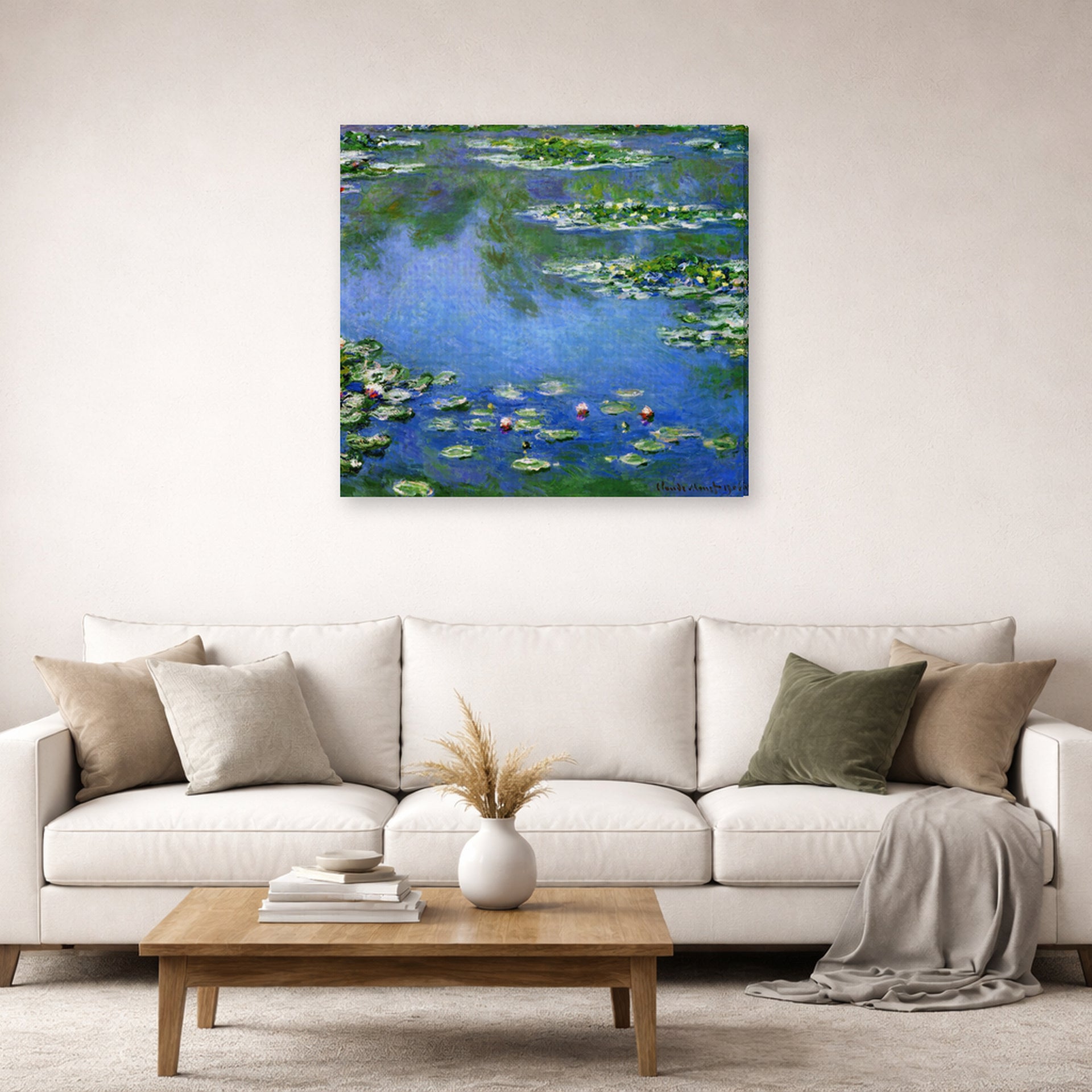Gallery-wrapped canvas print of Claude Monet's 'Water Lilies' displayed on a wall in a living room