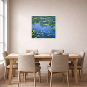 Unframed poster print of Claude Monet's 'Water Lilies' displayed on a wall in a dining room