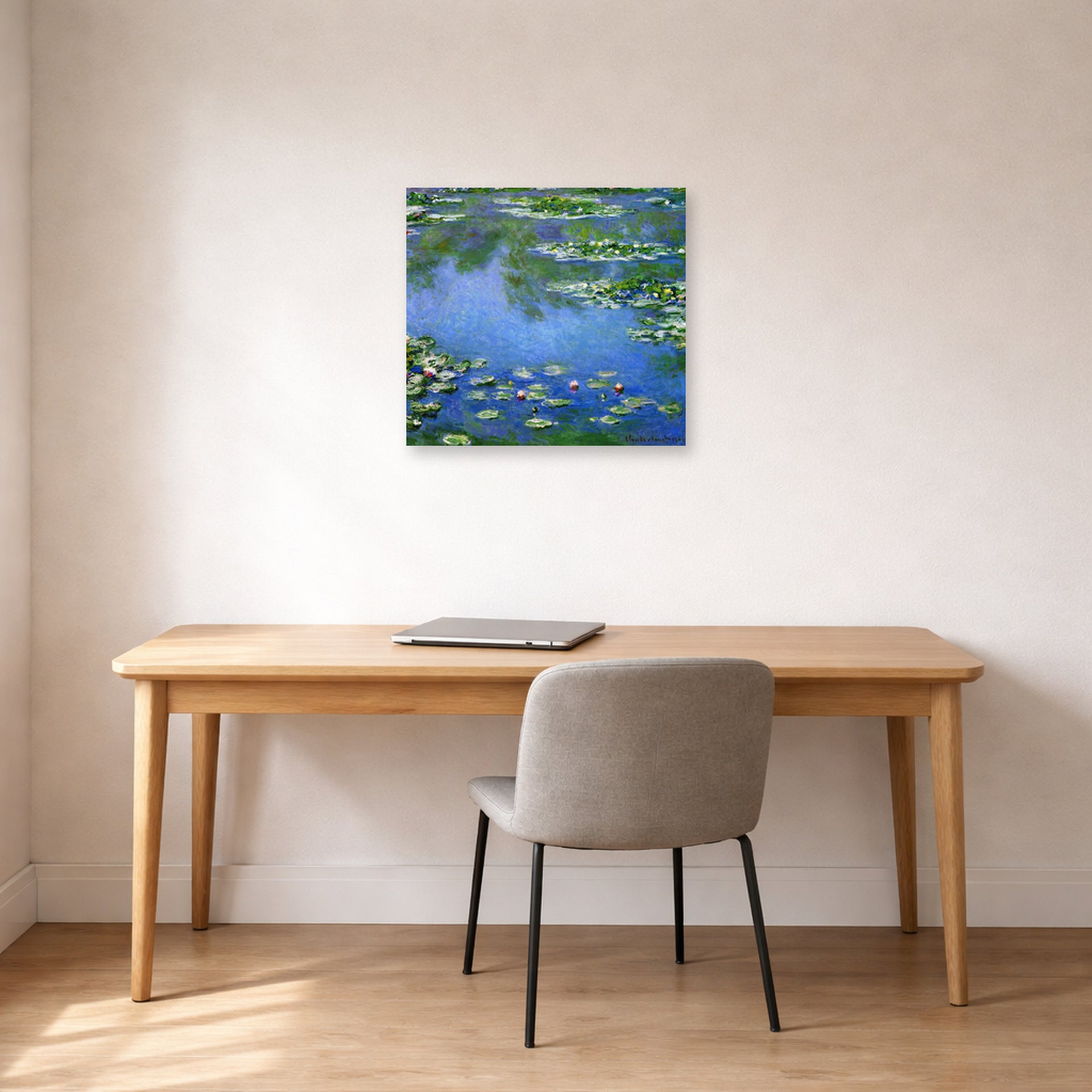 Unframed poster print of Claude Monet's 'Water Lilies' displayed on a wall in a office