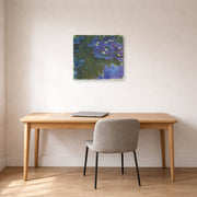 Unframed poster print of Claude Monet's 'Waterlilies in Bloom' displayed on a wall in a office