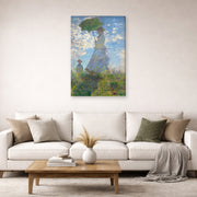 Gallery-wrapped canvas print of Claude Monet's 'Woman with a Parasol' displayed on a wall in a living room
