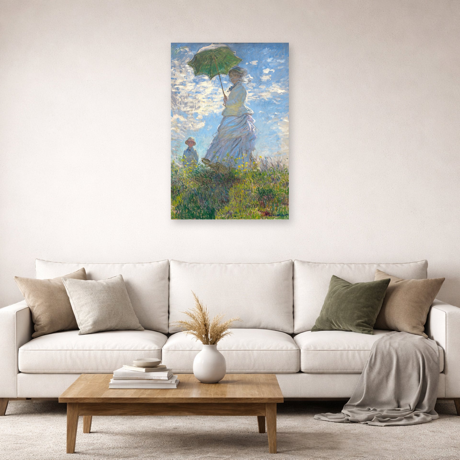 Unframed poster print of Claude Monet's 'Woman with a Parasol' displayed on a wall in a living room