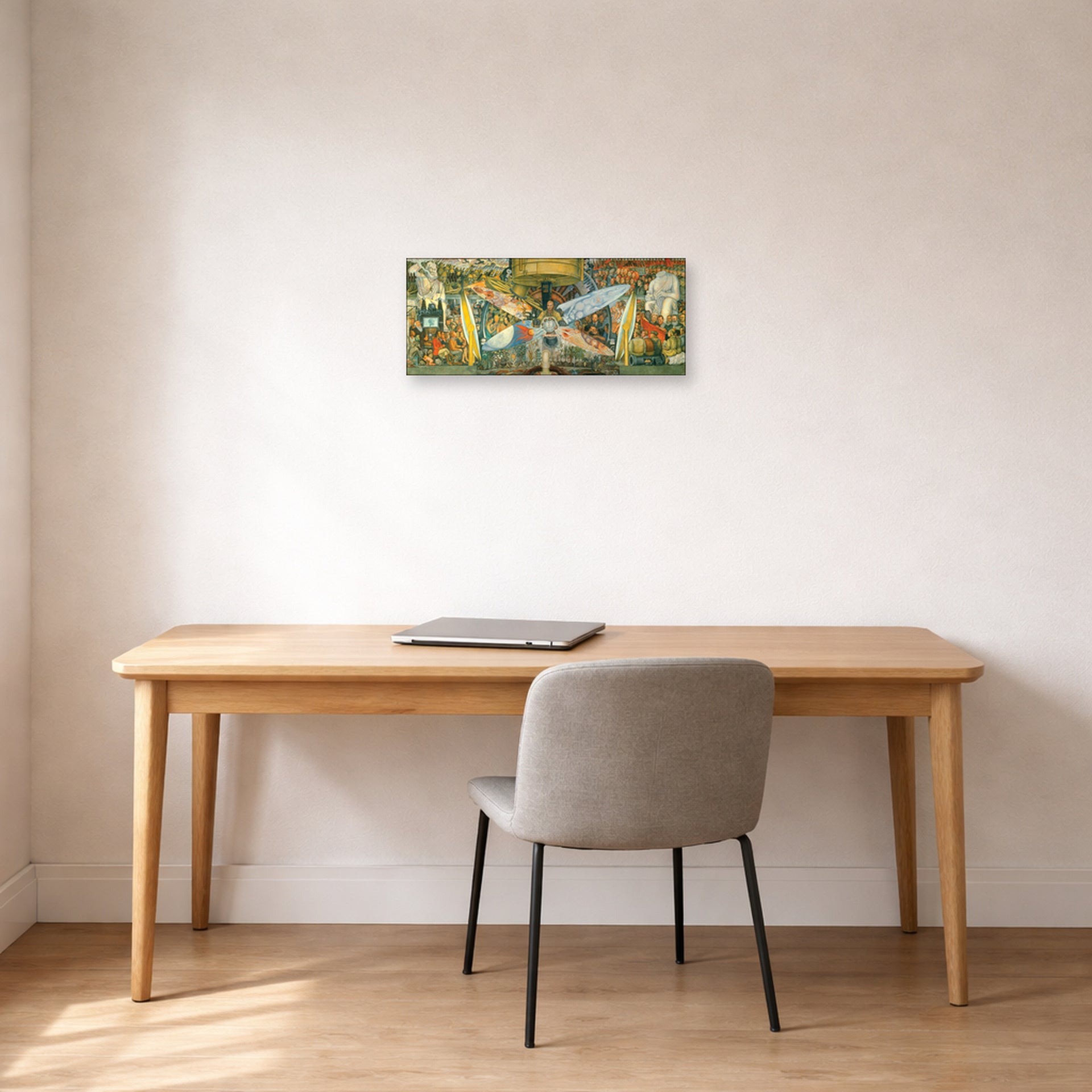 Unframed poster print of Diego Rivera's Man at the Crossroads displayed on a wall in a home office
