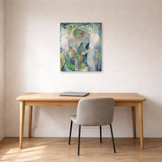 Unframed poster print of Diego Rivera's Woman at a Well displayed on a wall in a home office