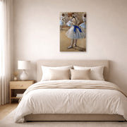 Unframed poster print of Edgar Degas's A Study of a Dancer displayed on a wall in a bedroom