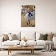 Unframed poster print of Edgar Degas's A Study of a Dancer displayed on a wall in a living room