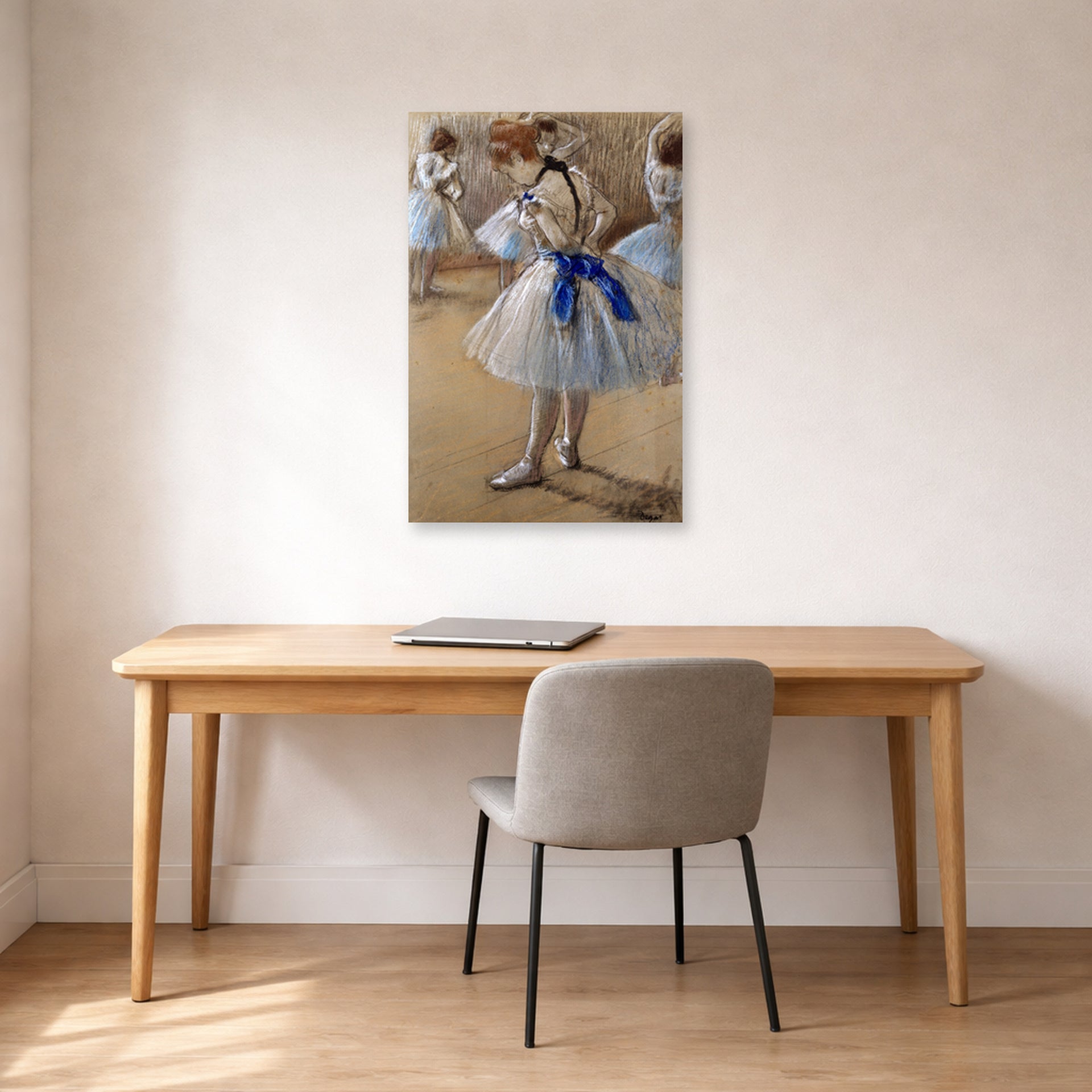 Unframed poster print of Edgar Degas's A Study of a Dancer displayed on a wall in a office