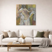 Gallery-wrapped canvas print of Edgar Degas's After the Bath Woman Drying displayed on a wall in a living room