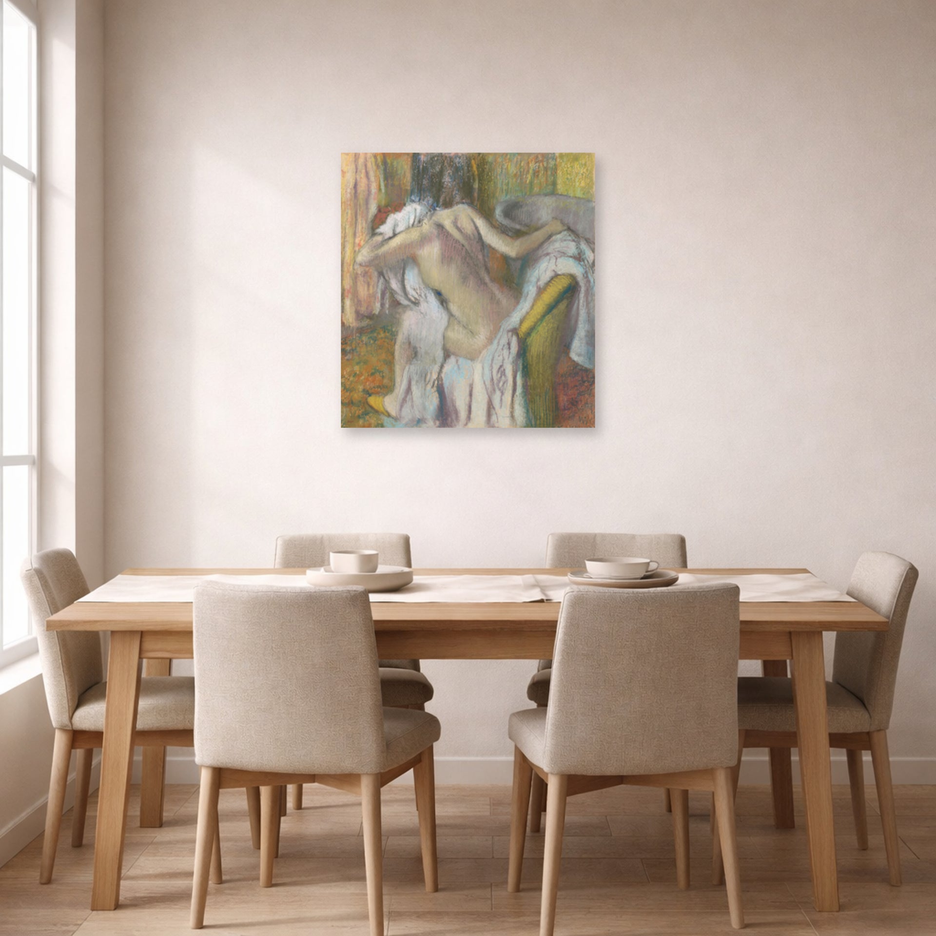 Unframed poster print of Edgar Degas's After the Bath Woman Drying displayed on a wall in a dining