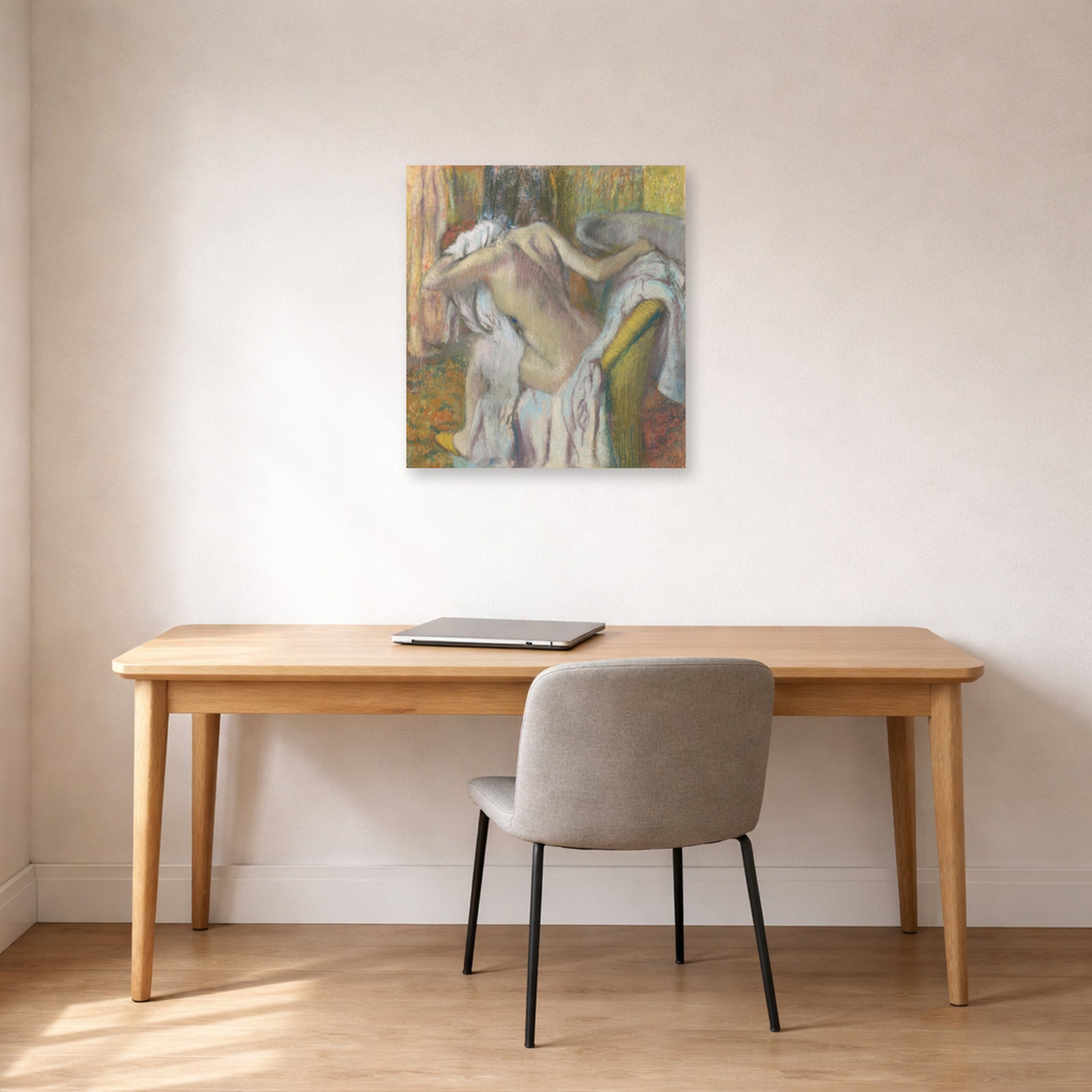 Unframed poster print of Edgar Degas's After the Bath Woman Drying displayed on a wall in a office
