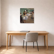 Unframed poster print of Edgar Degas's The Dance Class displayed on a wall in a office