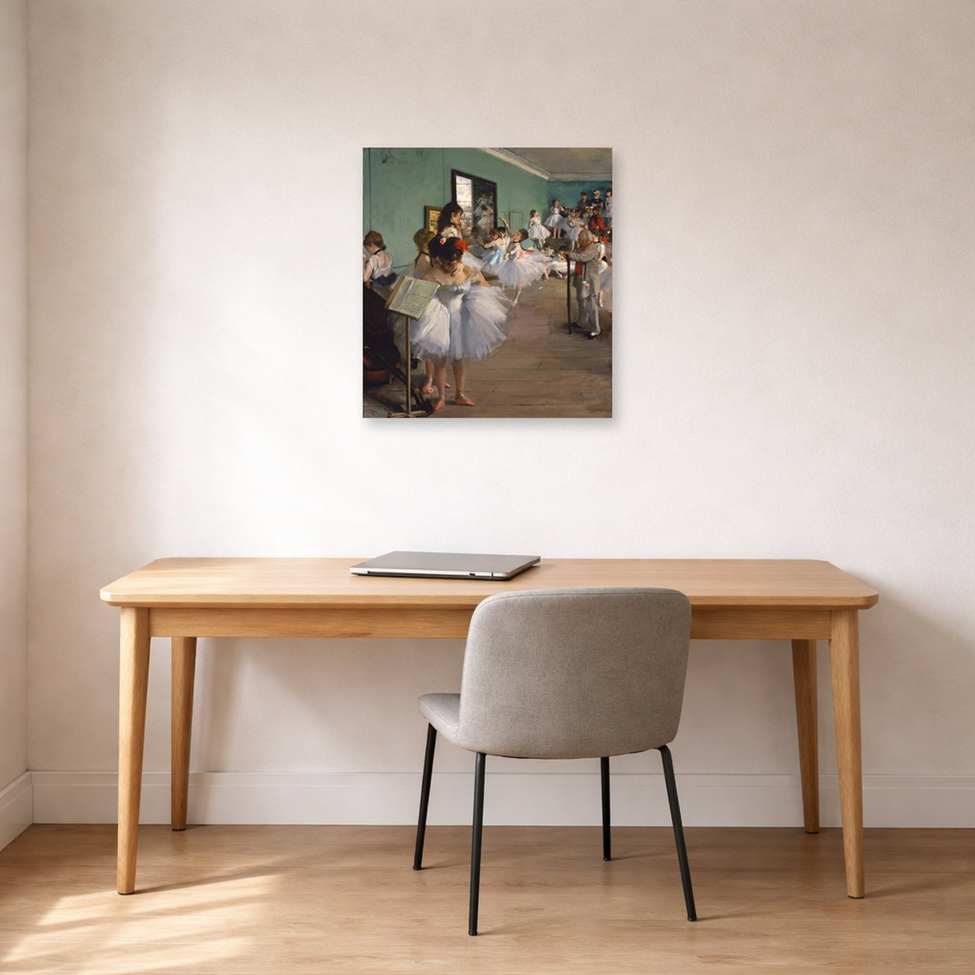 Unframed poster print of Edgar Degas's The Dance Class displayed on a wall in a office