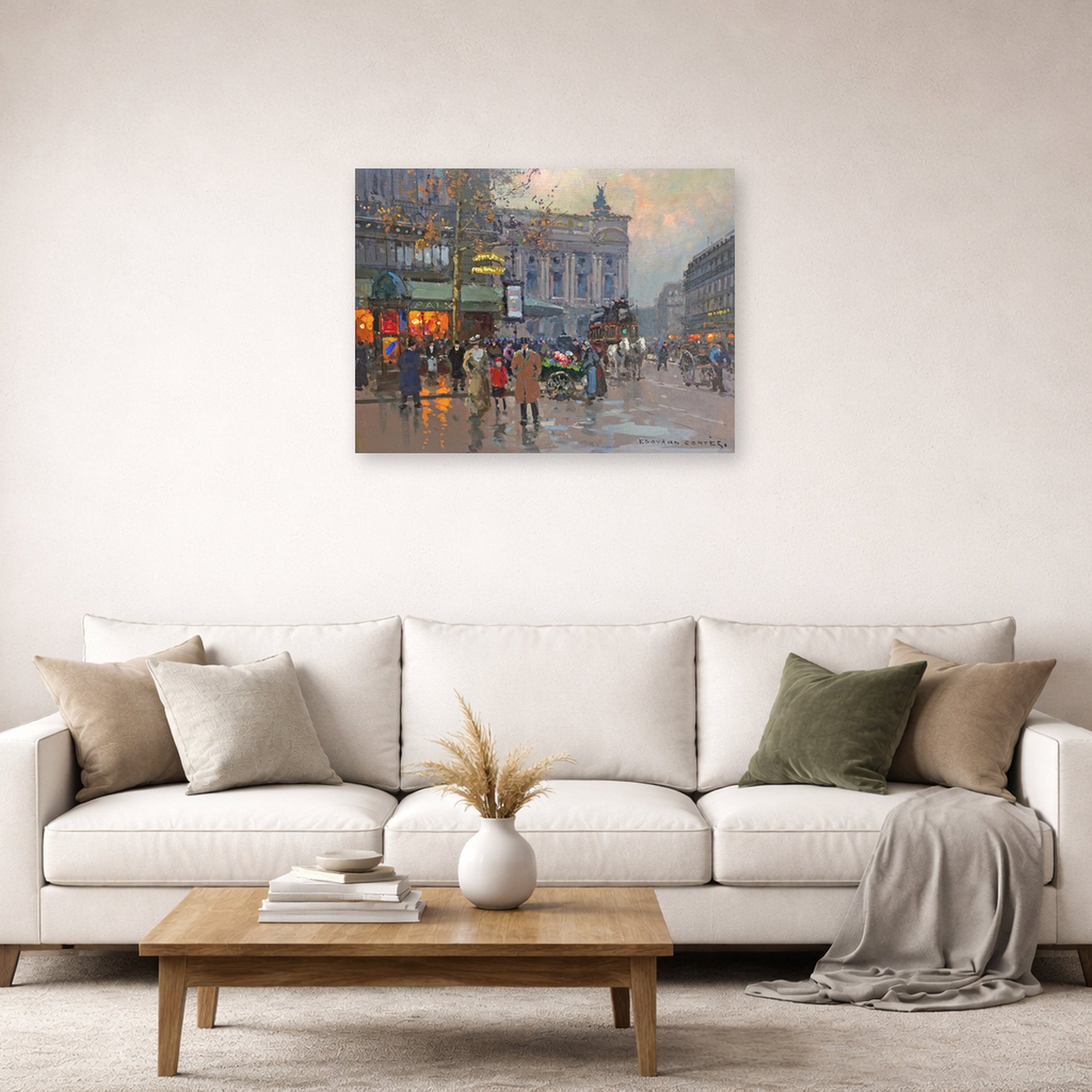 Unframed poster print of Édouard Cortès's Cafe de la paix displayed on a wall in a living room