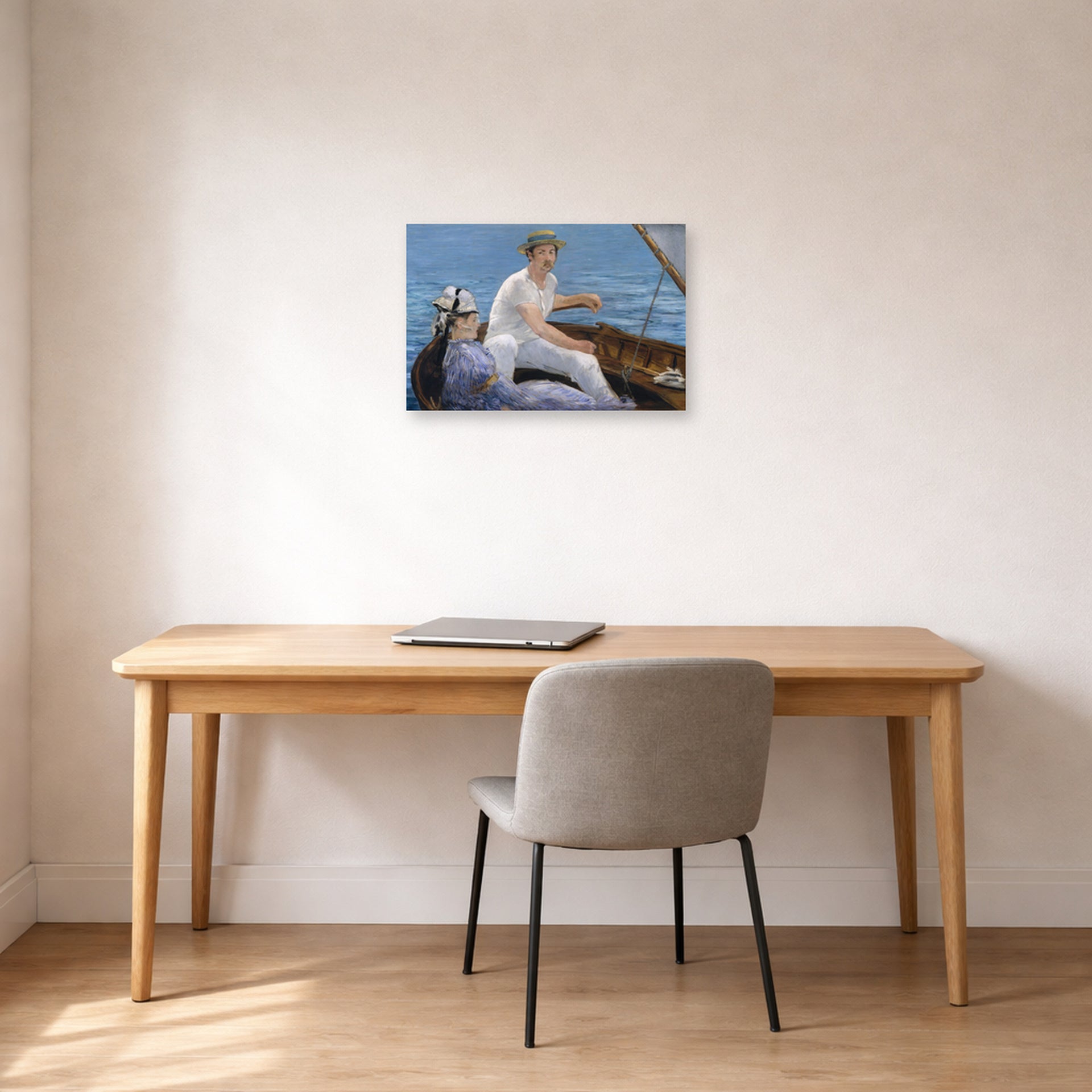 Unframed poster print of Edouard Manet's 'Boating, Metropolitan Museum of Art' displayed on a wall in a home office
