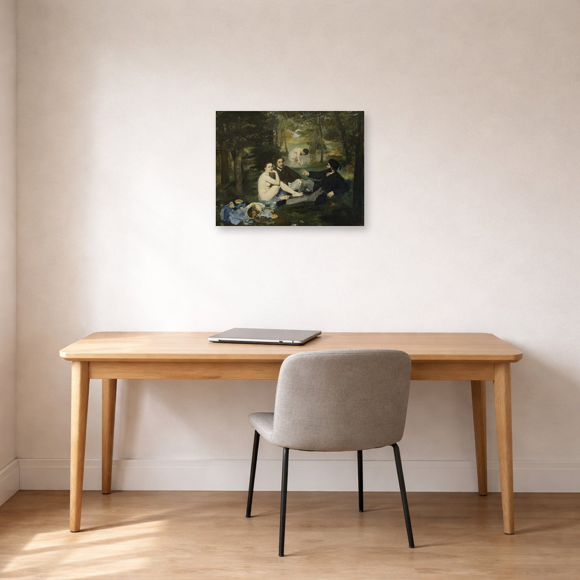 Unframed poster print of Edouard Manet's 'Luncheon on the Grass' displayed on a wall in a home office