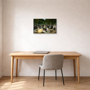 Unframed poster print of Edouard Manet's 'Music in the Tuileries Gardens' displayed on a wall in a home office