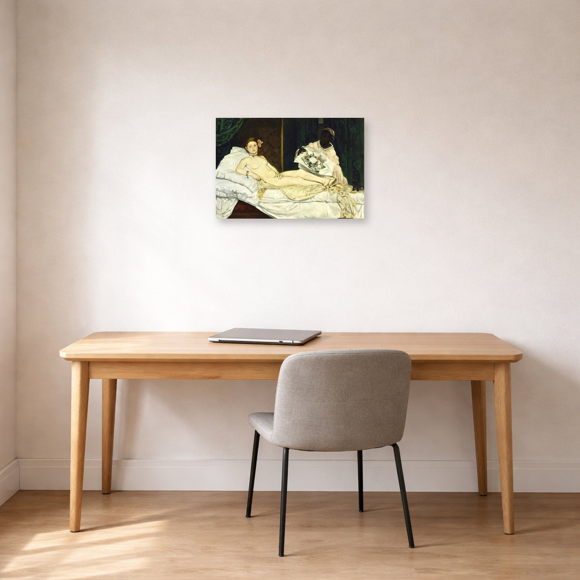 Unframed poster print of Edouard Manet's 'Olympia 1863' displayed on a wall in a home office