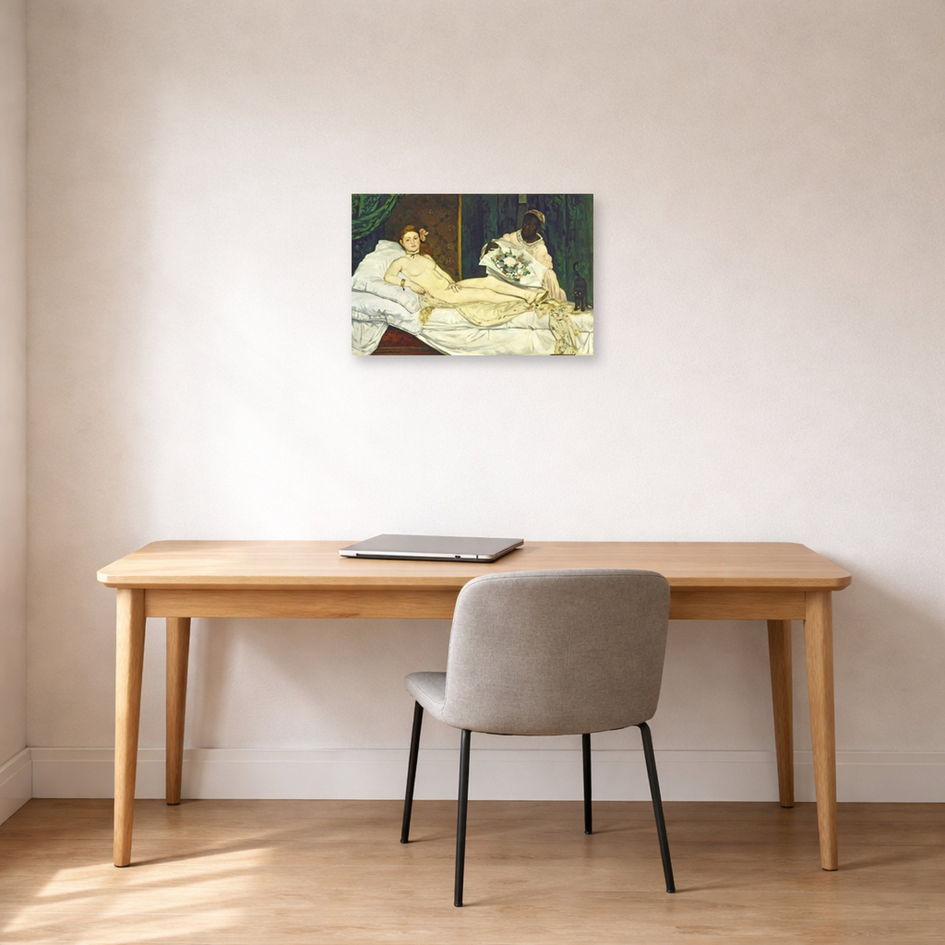 Unframed poster print of Edouard Manet's 'Olympia' displayed on a wall in a home office