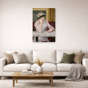 Unframed poster print of Edouard Manet's 'The Plum, National Gallery of Art' displayed on a wall in a living room
