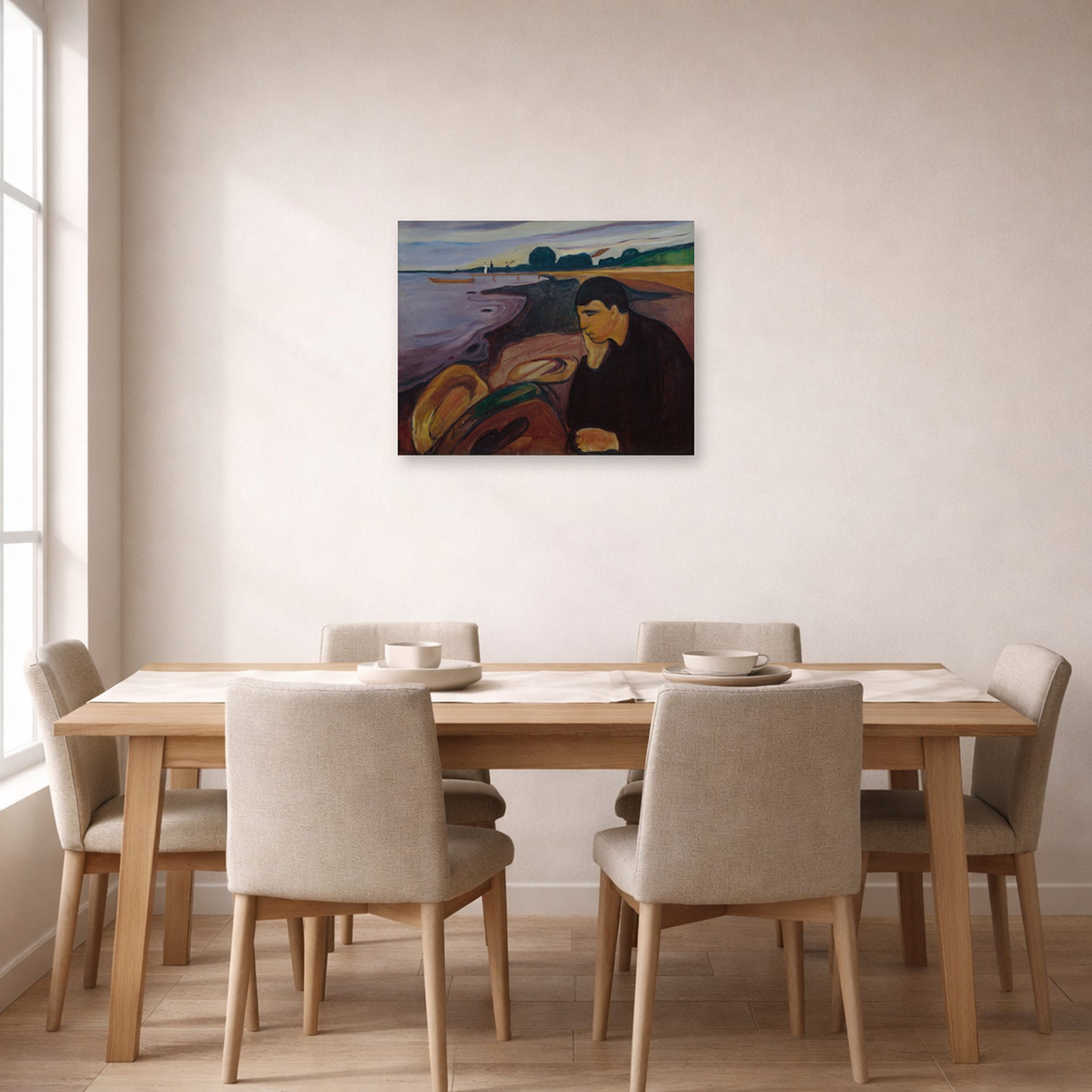 Unframed poster print of Edvard Munch's Melankoli displayed on a wall in a dining room