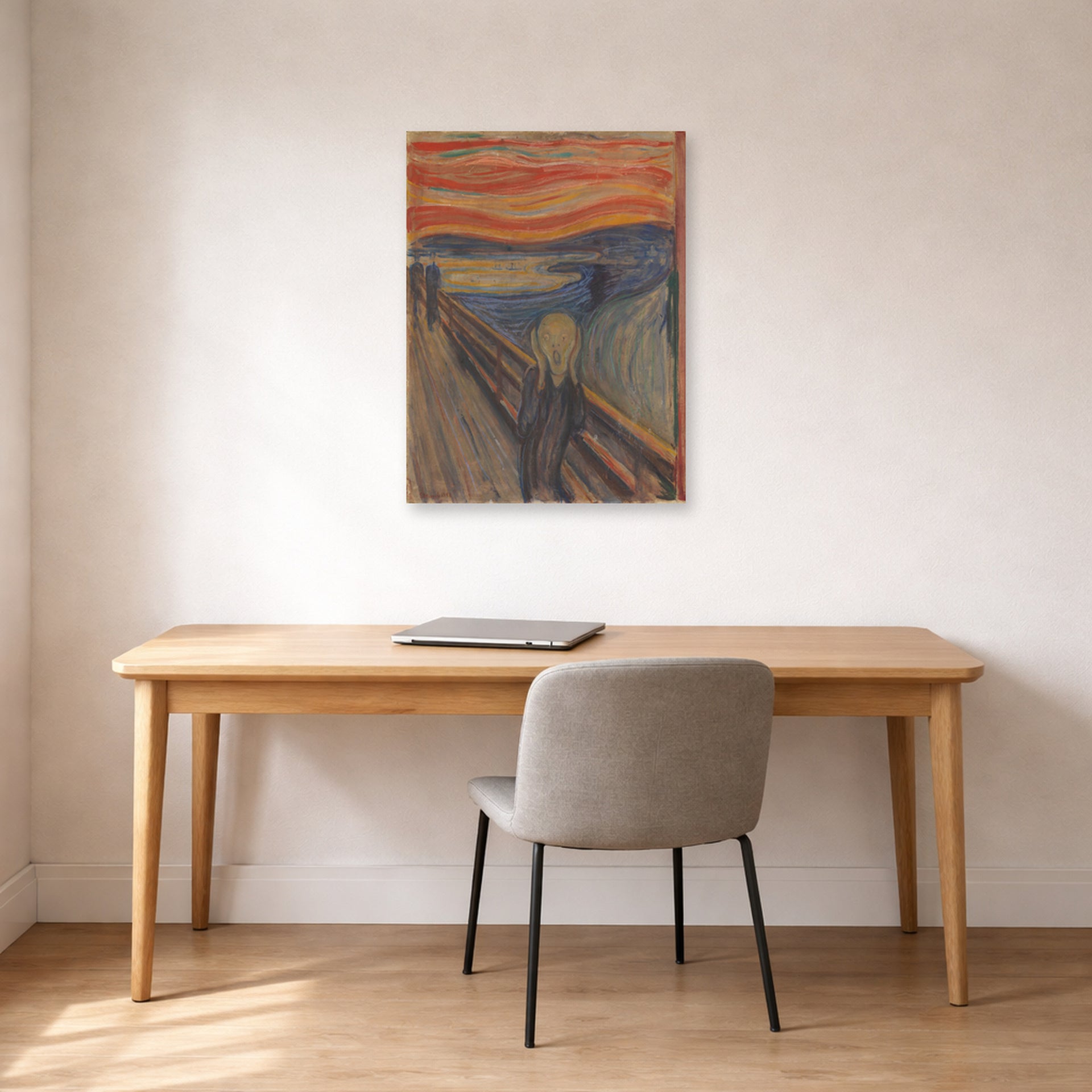 Unframed poster print of Edvard Munch's The Scream displayed on a wall in a home office