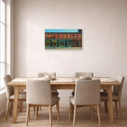 Gallery-wrapped canvas print of Edward Hopper's 'Early Sunday Morning' displayed on a wall in a dining room