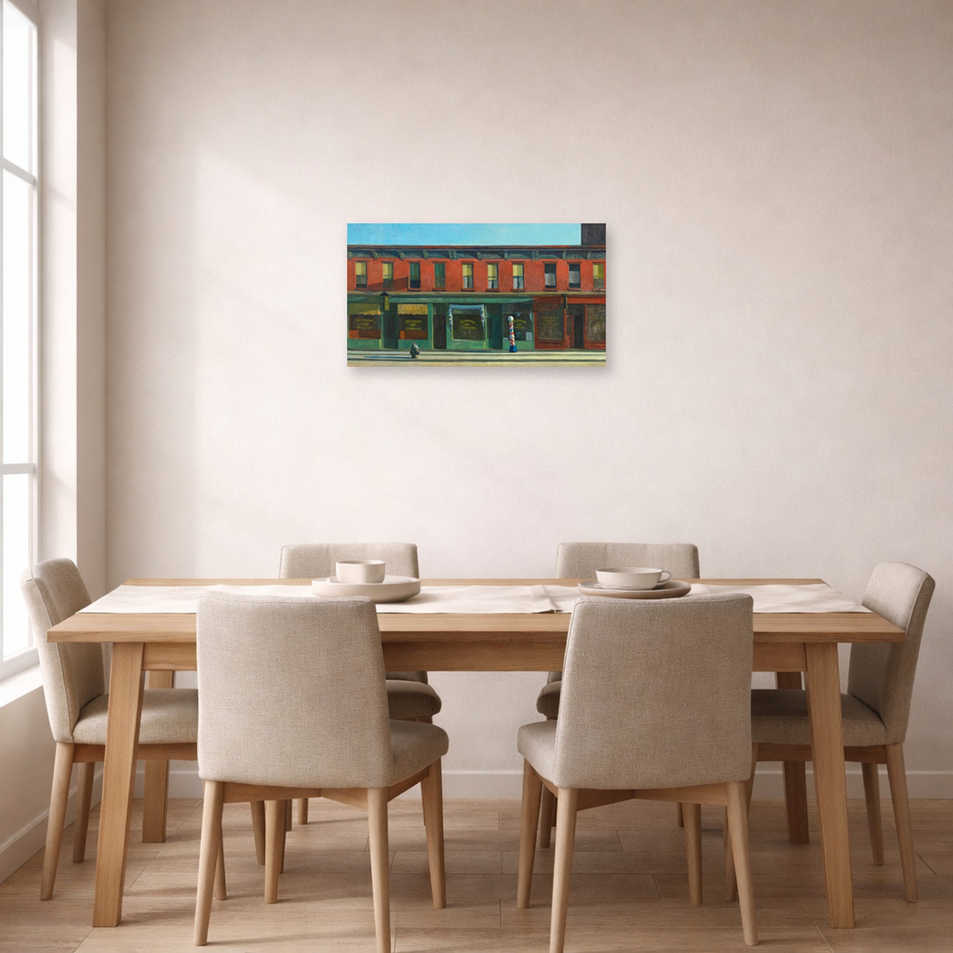 Unframed poster print of Edward Hopper's 'Early Sunday Morning' displayed on a wall in a dining room