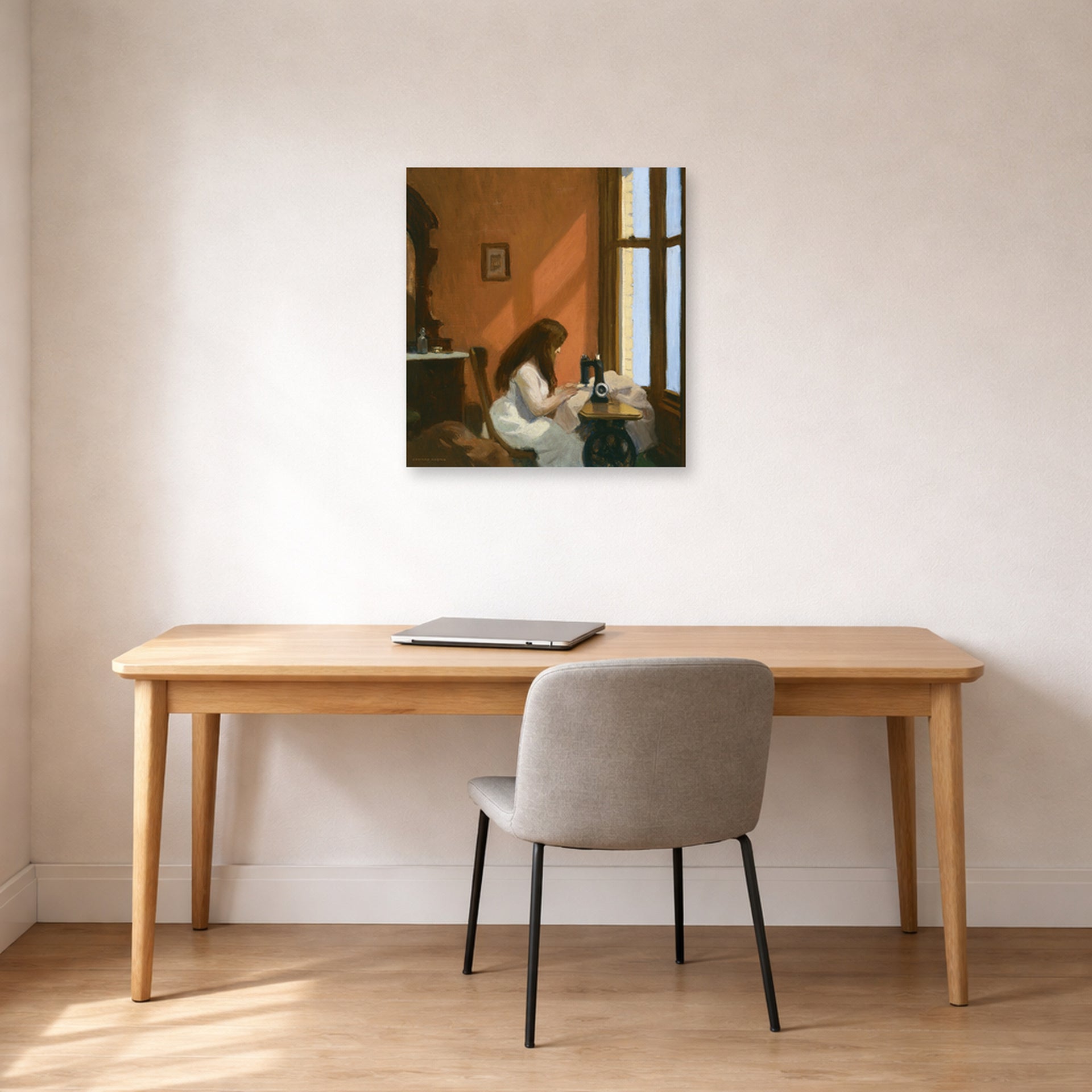 Unframed poster print of Edward Hopper's 'Girl at a Sewing Machine' displayed on a wall in an office
